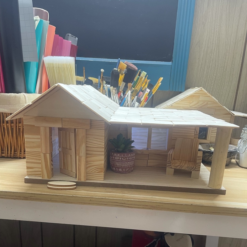 Handmade wood cabins and old general store.